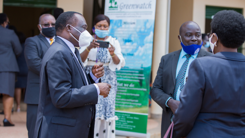 The chief Justice of Uganda, Honorable Justice Alfonse Dollo-Owiny (left) interacting with some of judges during the coffee break