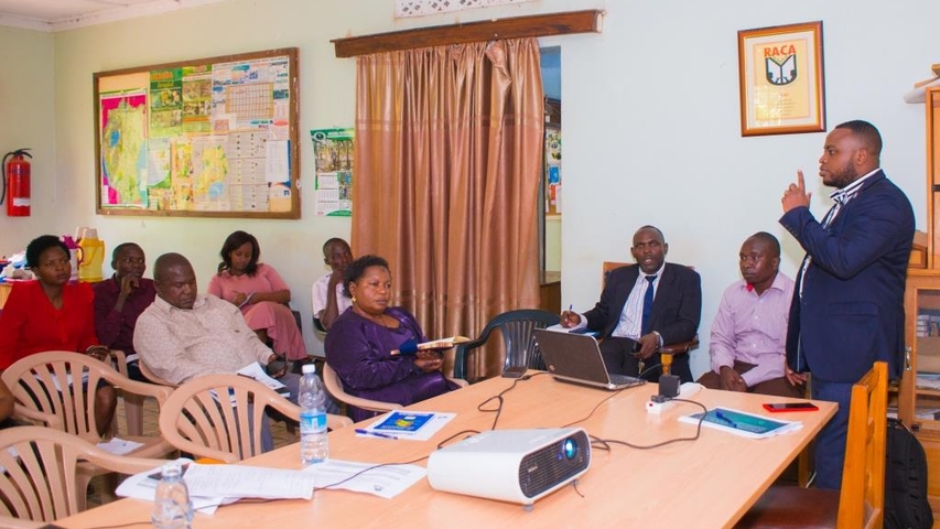 Mr. Edward Kamya; Principal Assistant Secretary-Rakai district giving opening remarks on behalf of the Chief Administrative officer.
