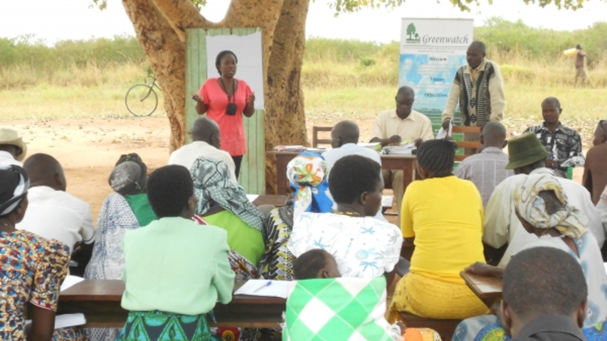 Community dialogue being chaired by Harriet Bibangamba