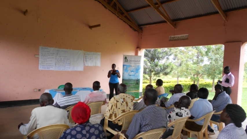 Greenwatch Research Officer talking to community members in Bullisa